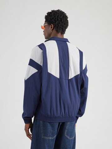 ADIDAS ORIGINALS - Chaqueta de entretiempo en azul