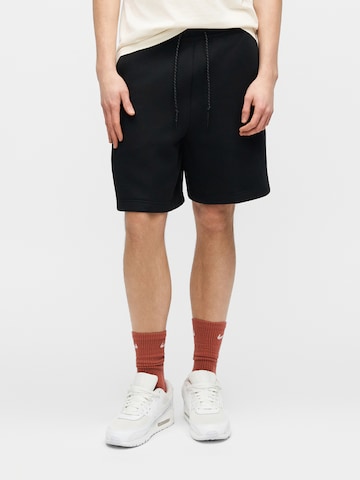 Loosefit Pantalon 'TECH FLC' Nike Sportswear en noir : devant
