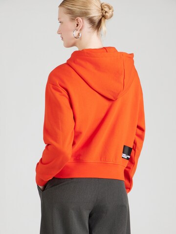 KARL LAGERFELD JEANS Суичър в оранжево: отзад