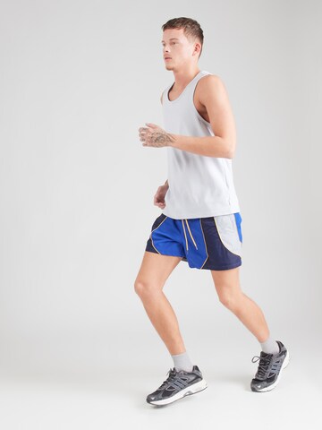 UNDER ARMOUR Normalny krój Spodnie sportowe 'Icon Volley' w kolorze niebieski