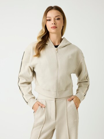 GUESS Zip-Up Hoodie in Brown: front