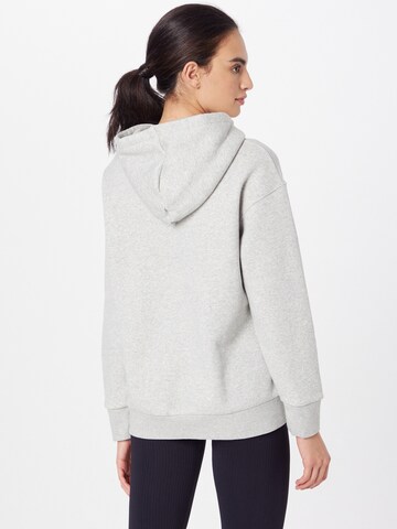 UNDER ARMOUR - Sweatshirt de desporto 'Essential' em cinzento
