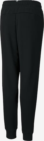 PUMA - Tapered Pantalón en negro