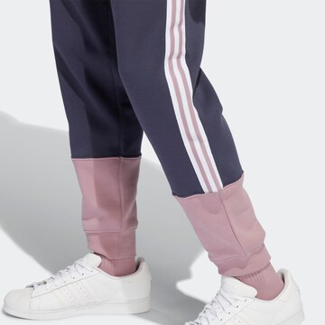Tapered Pantaloni di ADIDAS ORIGINALS in blu