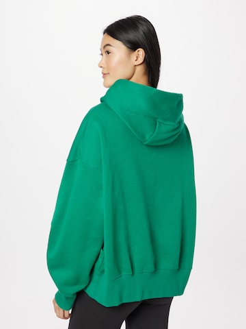 Nike Sportswear Bluzka sportowa 'PHOENIX FLEECE' w kolorze zielony