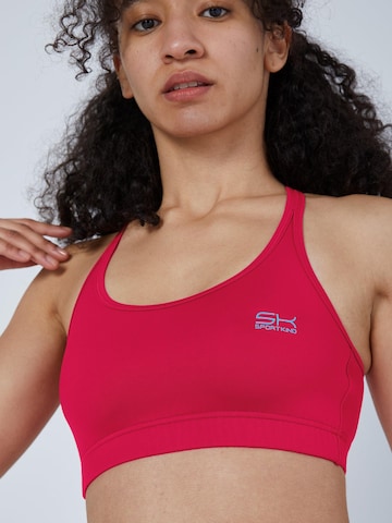 SPORTKIND Medium Support Sports bra 'Sport BH gekreuzte Träger' in Pink: front