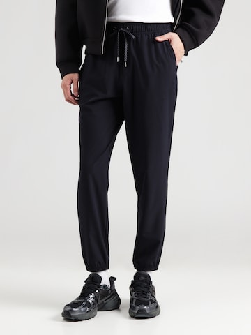 Tapered Pantaloni sportivi di SKECHERS in nero: frontale