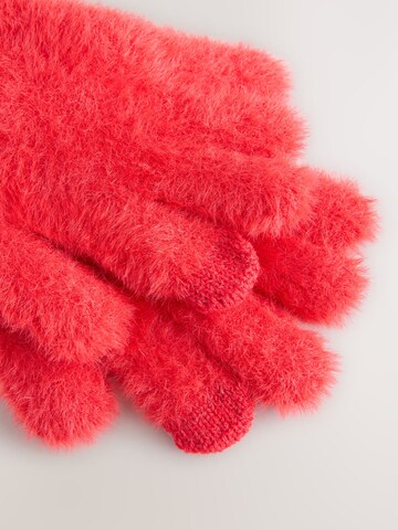 Next - Guantes en rojo