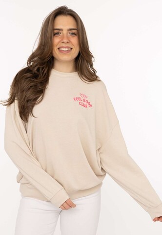 Sweat-shirt 'FEEL GOOD CLUB' Zwillingsherz en beige : devant