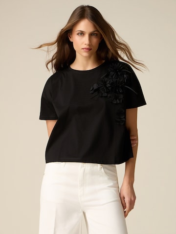 Top di oltre in nero: frontale
