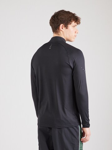 NIKE Functioneel shirt 'STRIDE' in Zwart