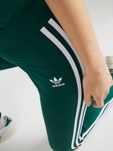 ADIDAS ORIGINALS Flared Leggings in Green