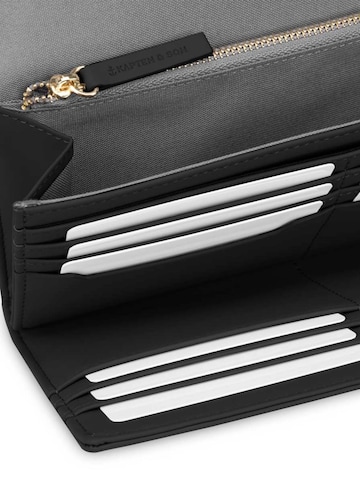 Kapten & Son Kukkaro 'Triomphe All Black' värissä musta