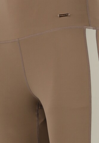 Athlecia Skinny Sports trousers 'Aspasia' in Brown