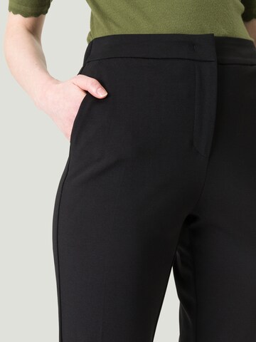 Slimfit Pantaloni con piega frontale di zero in nero