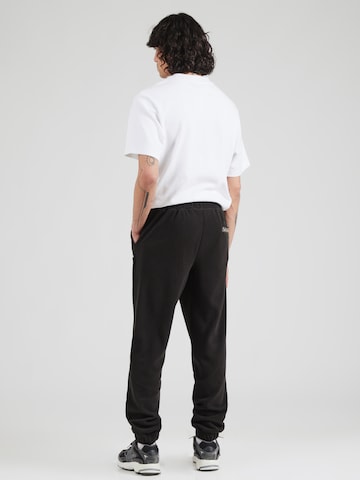 ELLESSE Tapered Broek 'Cache' in Zwart