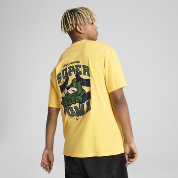 PUMA Shirt 'Graphics' in Yellow: front