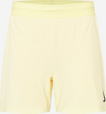 NIKE Sports trousers in Yellow: front