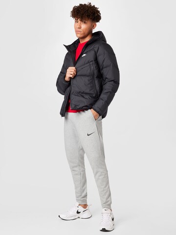 juoda Nike Sportswear Žieminė striukė