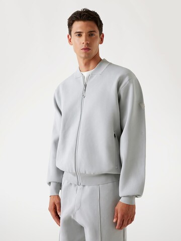 GUESS Zip-Up Hoodie in Grey: front