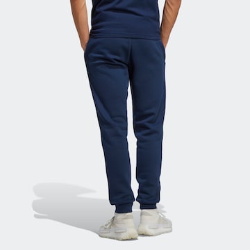 ADIDAS ORIGINALS Zwężany krój Spodnie 'Trefoil Essentials' w kolorze niebieski