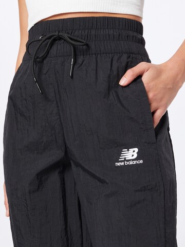 new balance - Tapered Calças de desporto em preto