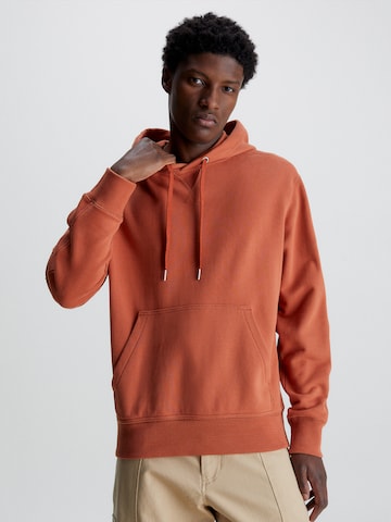 Sweat-shirt Calvin Klein Jeans en orange : devant