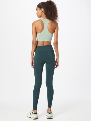 Skinny Pantaloni sportivi di Hummel in verde