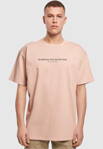 Merchcode Shirt 'Never Give Up' in Orange: front