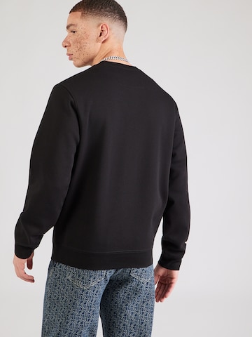 Bluză de molton de la GUESS pe negru