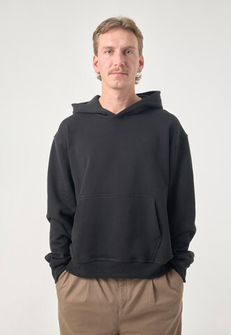 Cleptomanicx Kapuzenpullover 'Boxy Hooded Ligull Boxy Crop' in Schwarz: Vorderseite