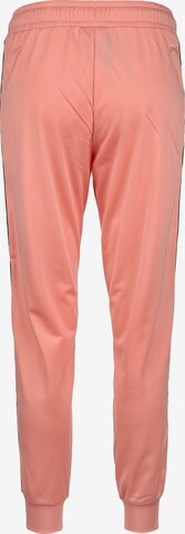 Tapered Pantaloni sportivi 'Jacoba' di FILA in rosa
