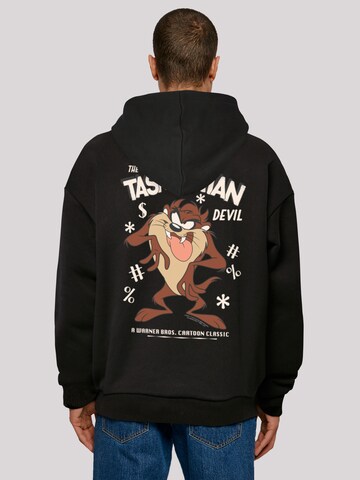 F4NT4STIC Sweatshirt 'Looney Tunes Vintage Tasmanian Devil' in Zwart: voorkant