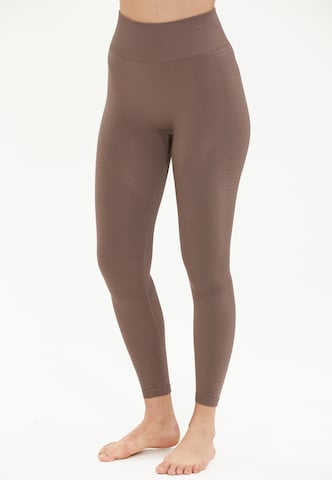 Athlecia Skinny Workout Pants 'NAGAR' in Brown: front