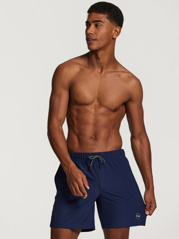 Shiwi Badshorts 'easy mike solid 4-way stretch' i blå: framsida