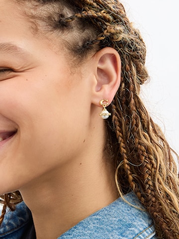 COACH - Pendientes en beige: frente