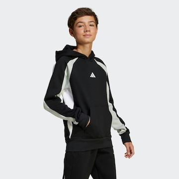 ADIDAS SPORTSWEAR - Camiseta deportiva en negro