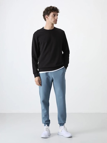 Tommy Life - Skinny Calças de desporto 'Jogginghose' em azul