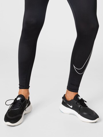 NIKE Skinny Sportbroek in Zwart