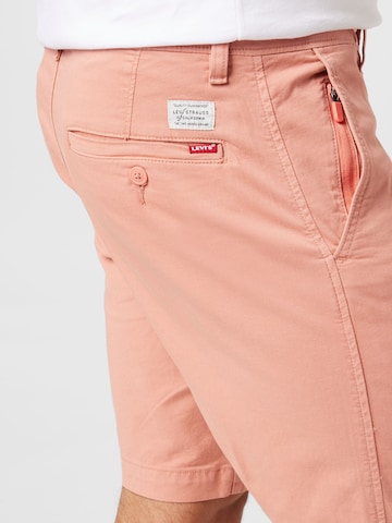 LEVI'S ® Tapered Shorts in Orange