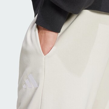 ADIDAS SPORTSWEAR Tapered Sports trousers 'Essentials Feel Cozy' in Grey