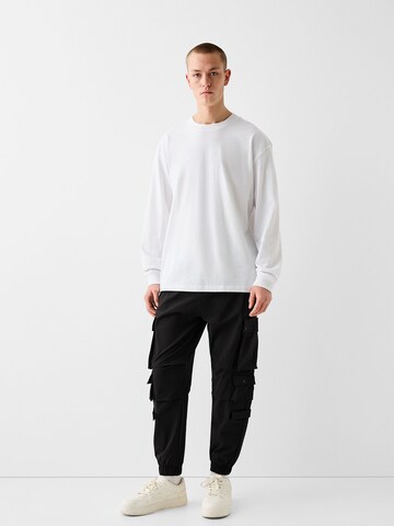 Bershka Tapered Cargo nadrágok - fekete