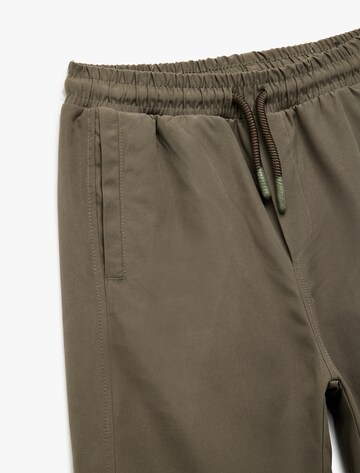 Koton Tapered Broek in Groen