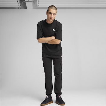 PUMA Tapered Sports trousers 'Essentials' in Black