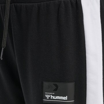 Effilé Pantalon Hummel en noir