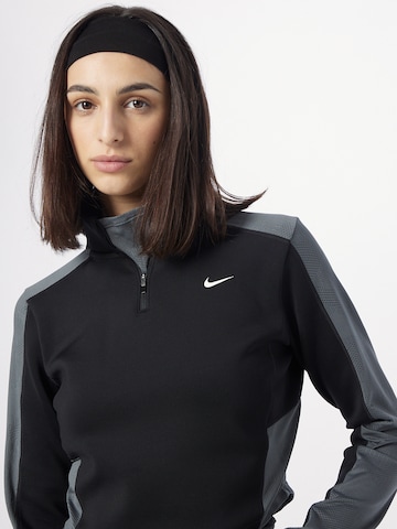 NIKE - Camiseta funcional en gris