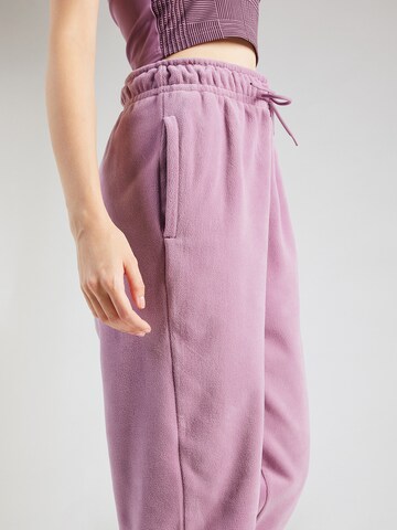 NIKE - Tapered Pantalón deportivo 'ONE' en lila