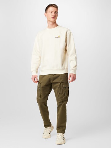 Carhartt WIP Collegepaita 'American Script' värissä beige