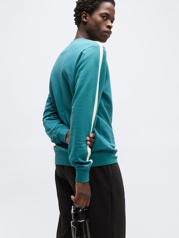 PUMASweater majica 'ESS ELEVATED' - zelena boja