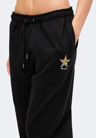 Tapered Pantaloni di GUESS JEANS in nero